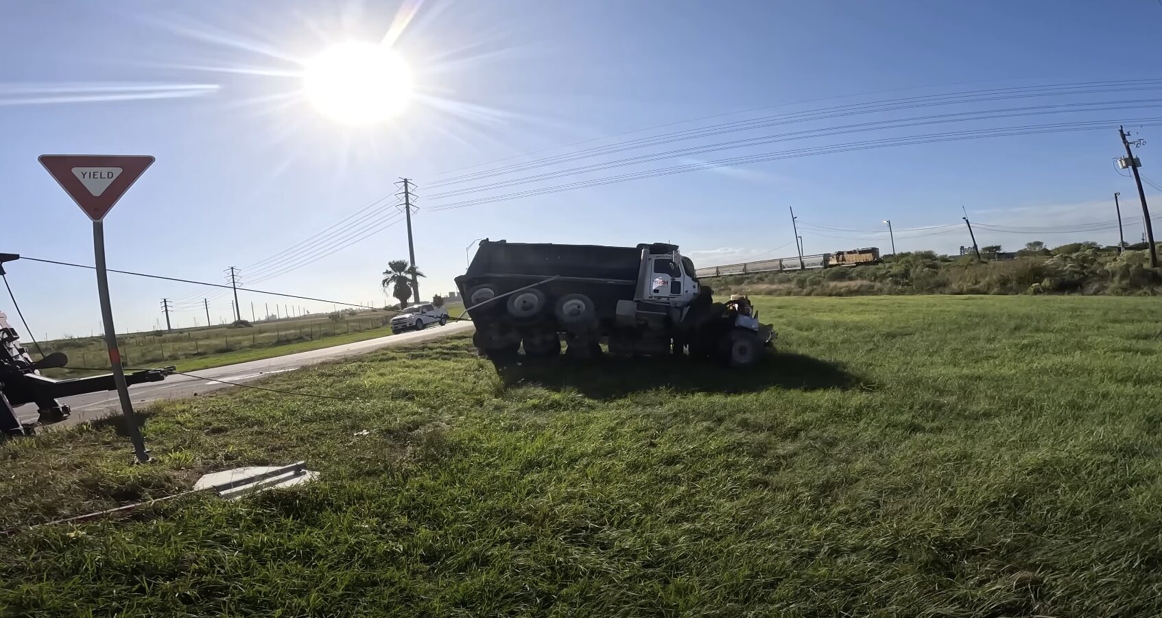 Heavy-duty tow truck performing roadside recovery for broken down truck